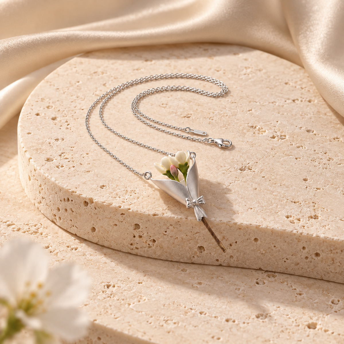 Whispering Petals silver pendant on ivory travertine